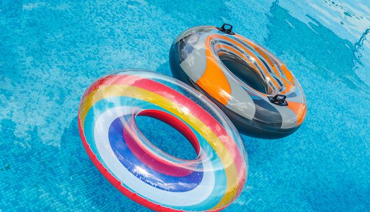 Inflatable-water-activities-circles-tuba-float-on-the-water-in-the-pool.-Concept,-fun,-perky-summer-and-relaxation